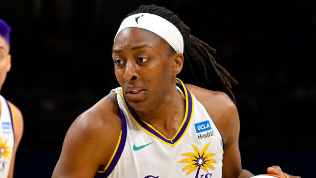 Sparks forward Nneka Ogwumike dribbles the ball during a game.